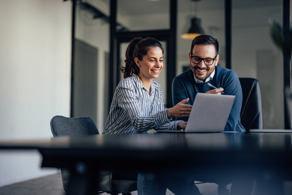 two business colleagues, looking at something online