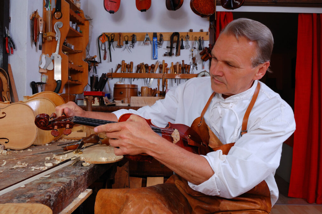 Violin builder and his workshop